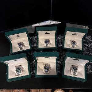 Elegant Silver Watch with Black and Green Dial